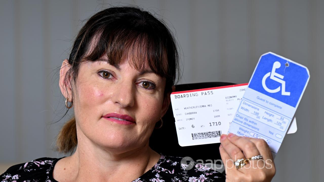 Emma Weatherley with her plane baording ticket