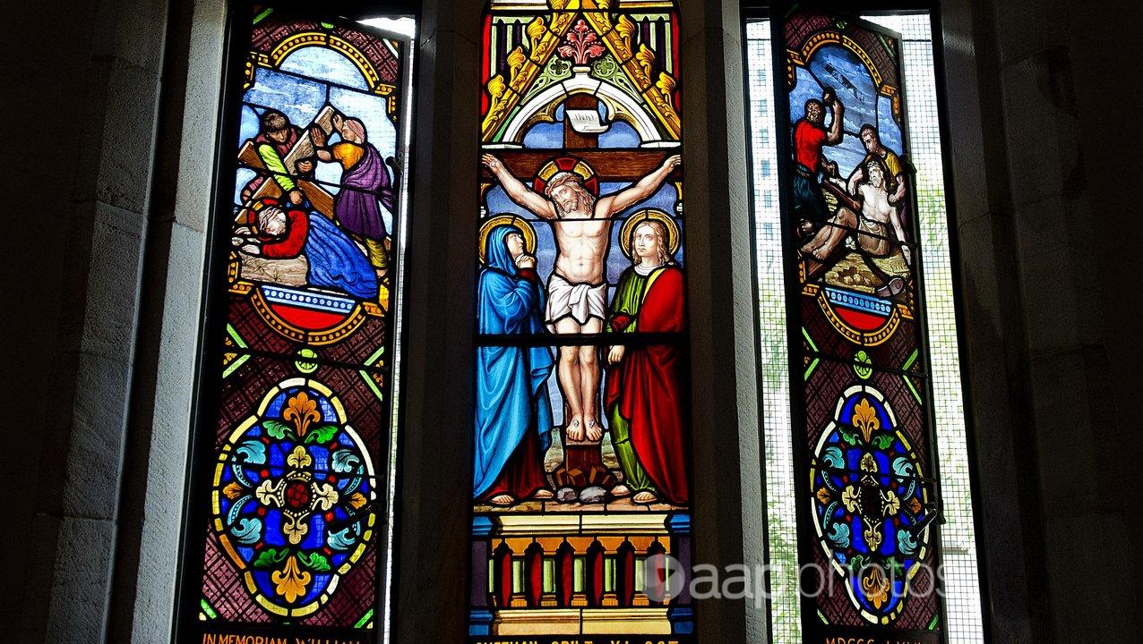 Stained glass depicting the crucifixion in a church.