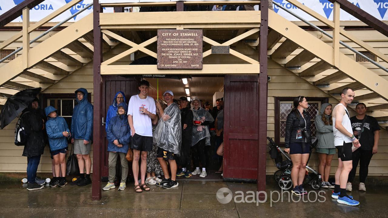 People shelter from the rain ahead of the Stawell Gift.