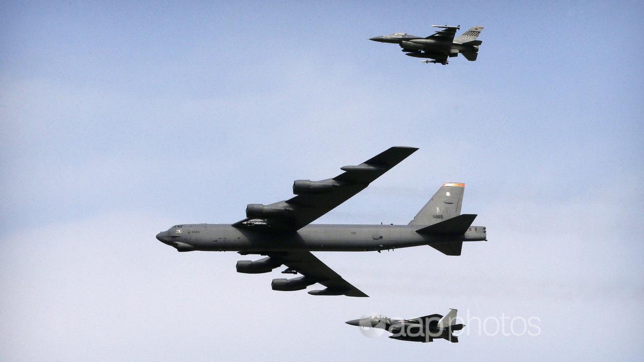B-52 bomber and two fighter jets
