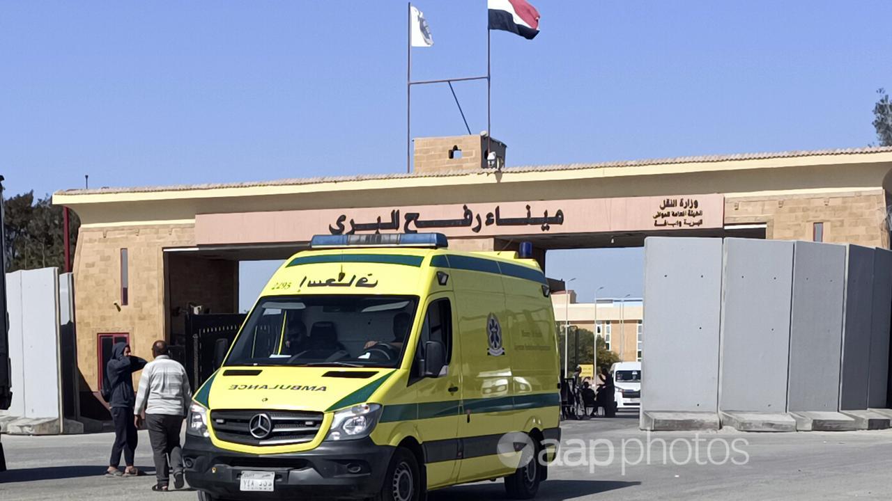An ambulance carrying bodies of aid workers enters Egypt from Gaza.