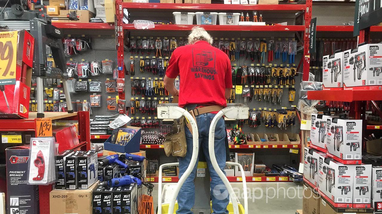 An employee is seen working in a Bunnings hardware store