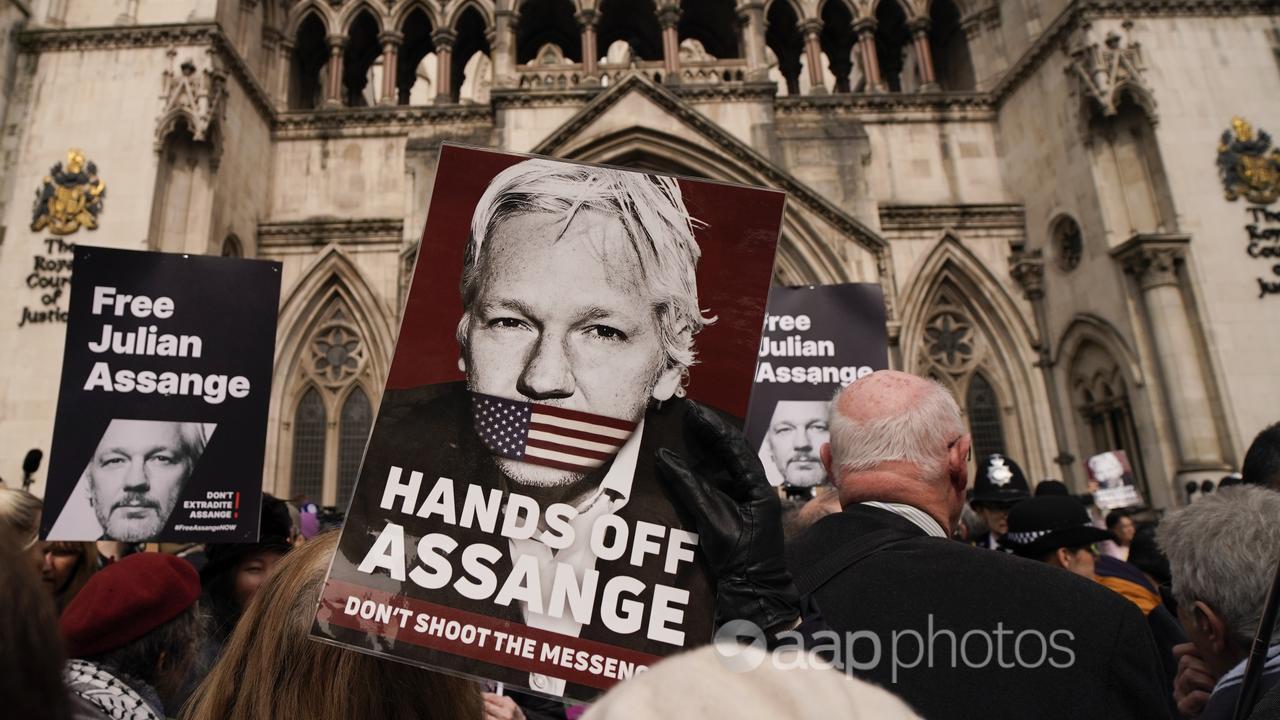 Supporters of Julian Assange protest outside the High Court, London