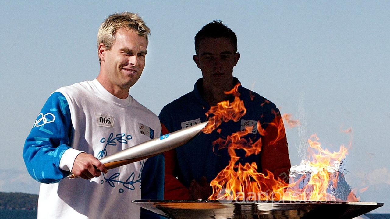 Shane Heal (L) lights Olympic Cauldron in 2004 (file image)