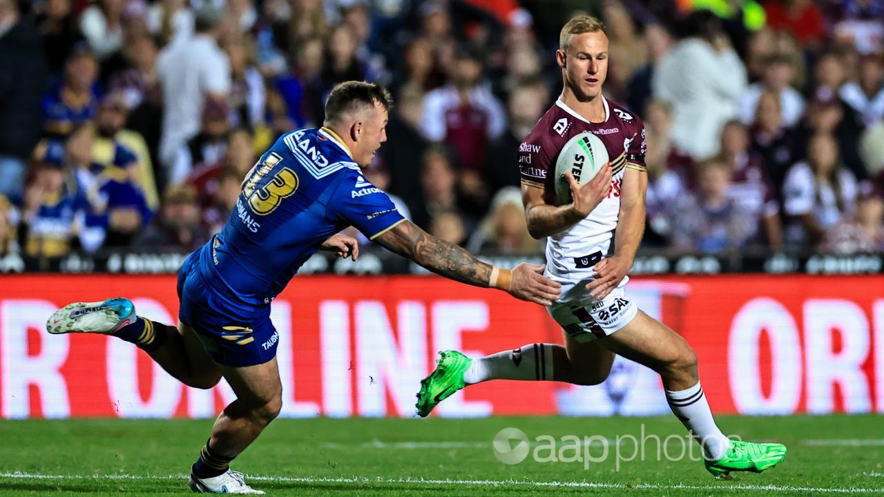 Manly's Daly Cherry-Evans runs with the ball against the Eels.
