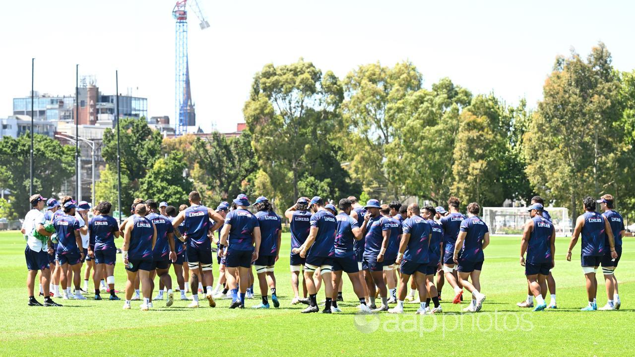 Rebels players take a break during a  training session.