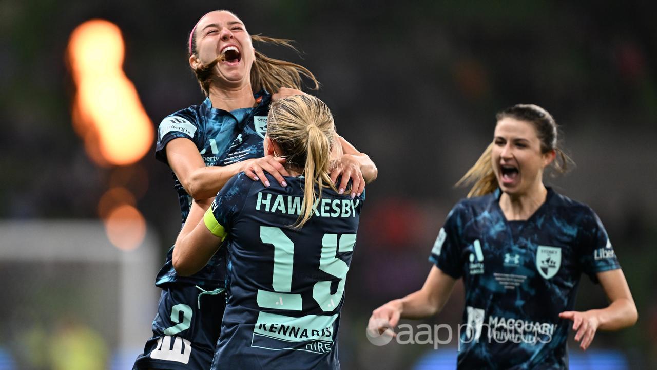 Shea Connors (left) celebrates her grand final goal.