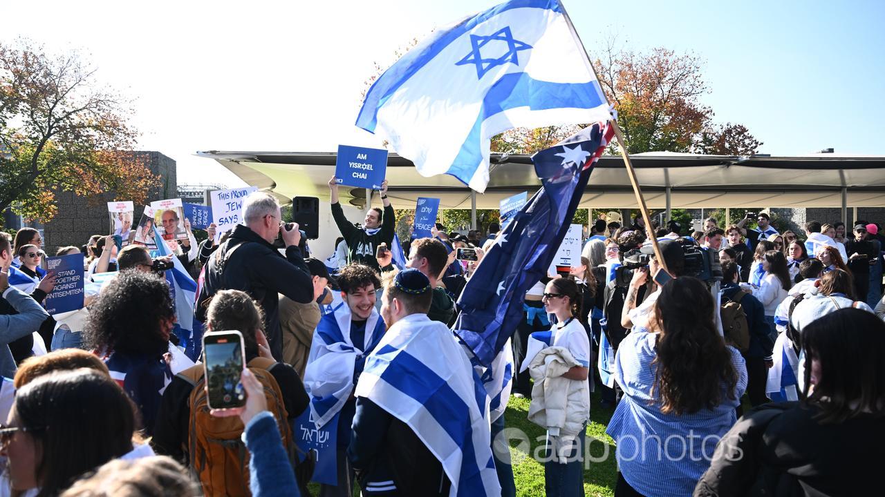 Members of the Jewish community gathered outside Melbourne uni.