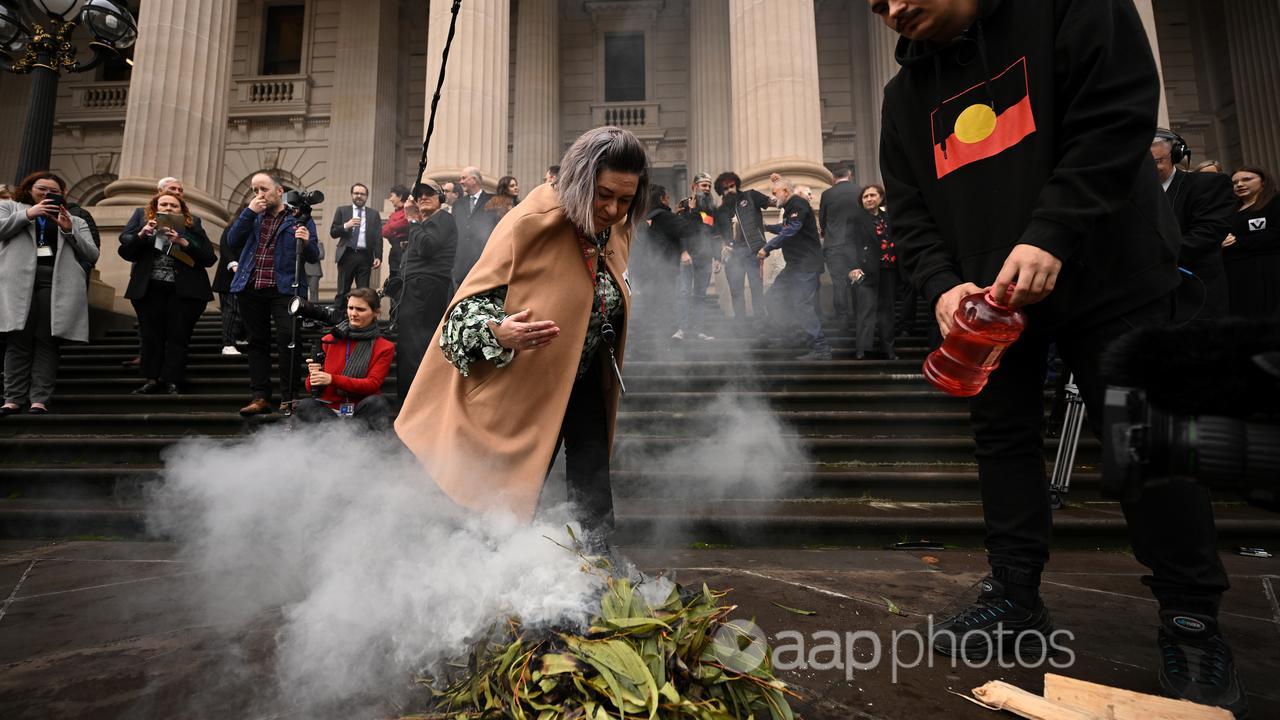 A smoking ceremony on the steps of Victorian Parliament in Melbourne