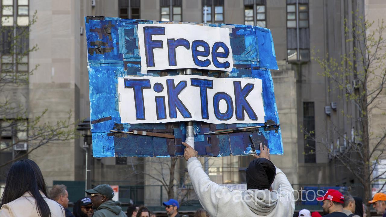 A man carries a Free TikTok sign (file image)