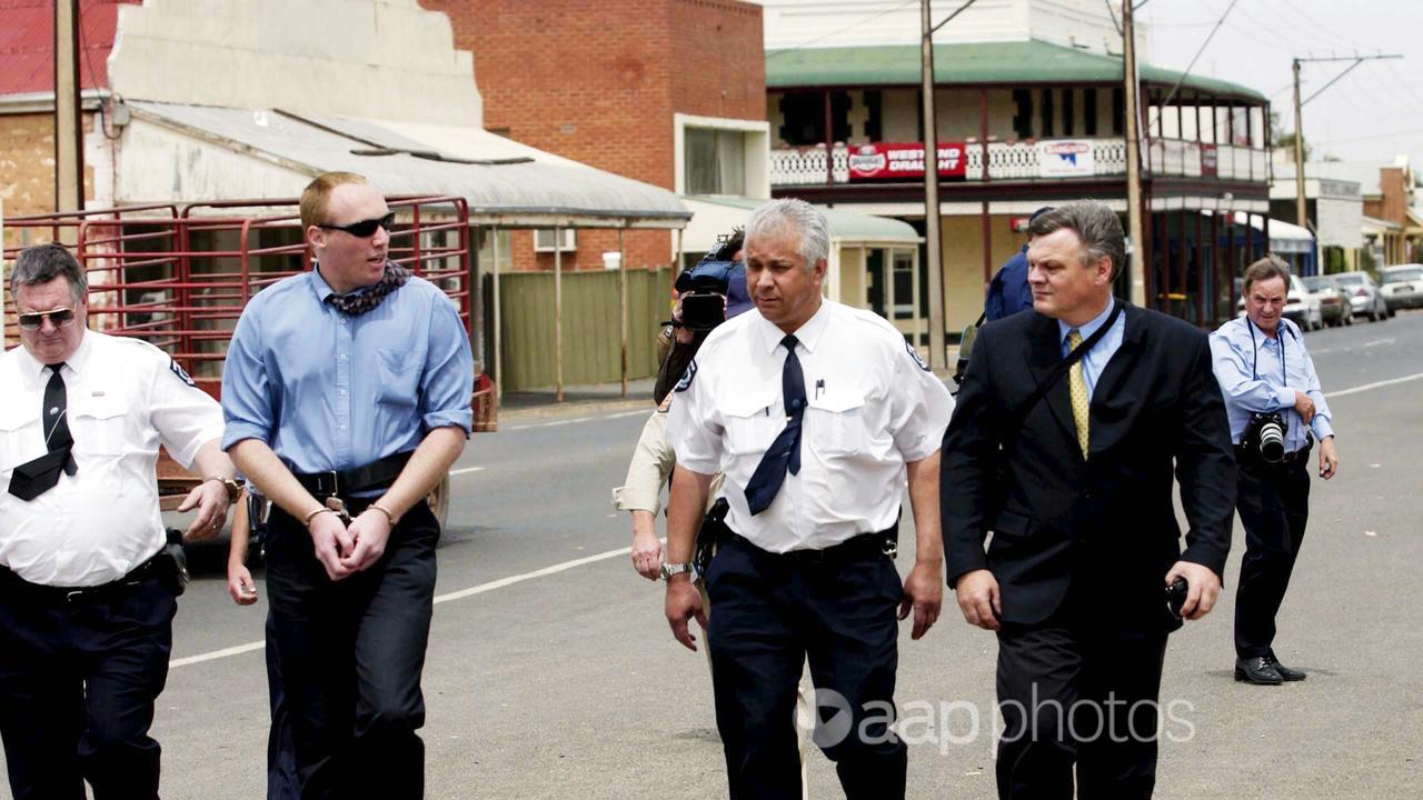 Robert Joe Wagner esorted by court sheriffs