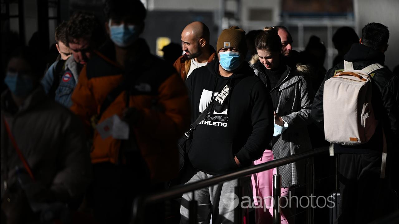 Melbourne airport passengers queue for bus