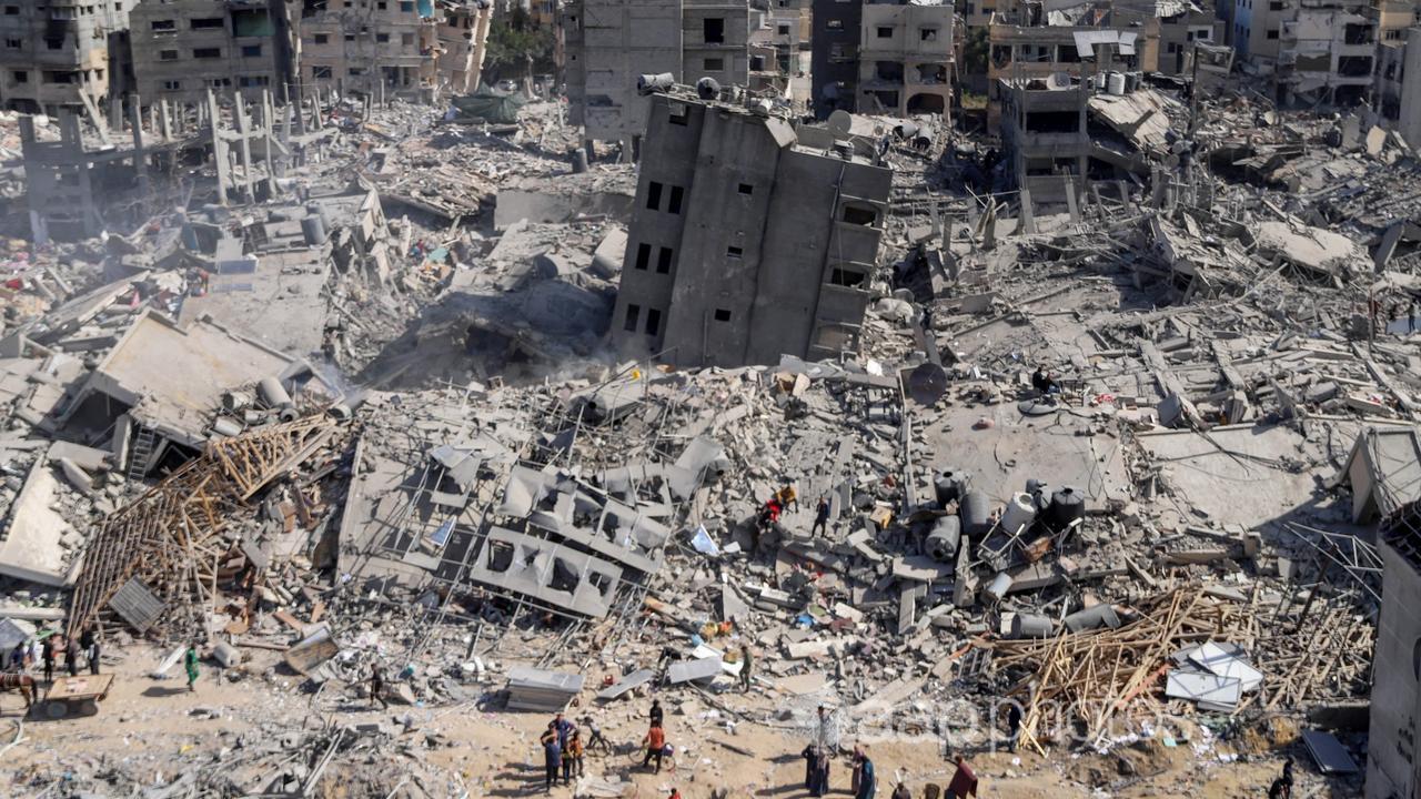 Bird's eye view as Palestinians inspect the damaged Al-Shifa Hospital.