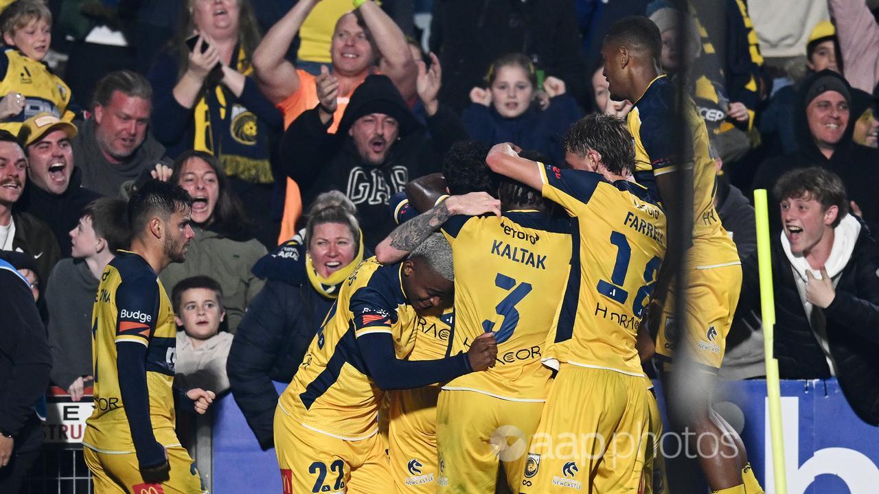 CCM players celebrate Ryan Edmondson's late equaliser. 