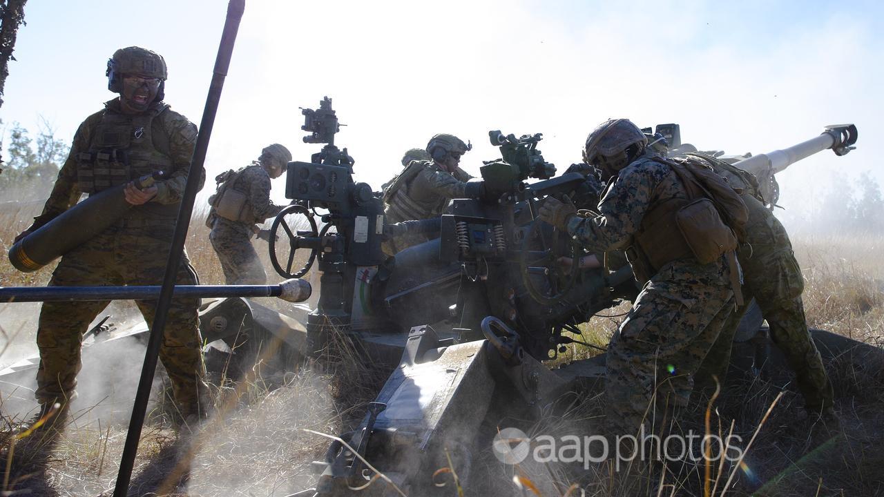 Soldiers fire a Howitzer at Shoalwater Bay in Queensland