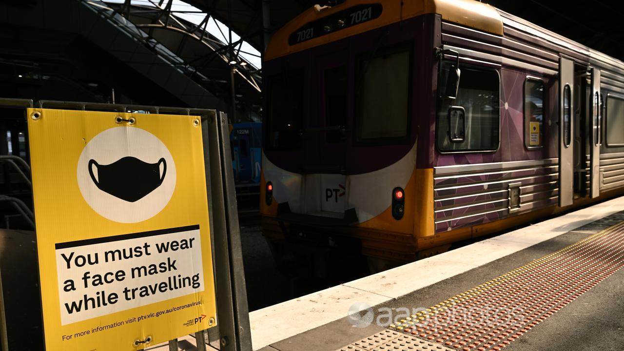 Signage reminding train passengers to wear masks, January 2022.