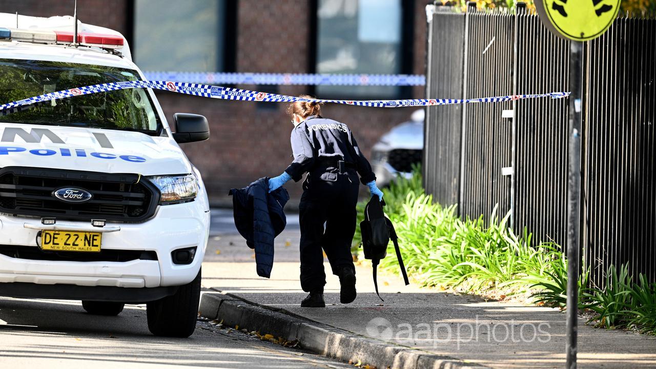 Police forensics officer at the scene of a stabbing in Sydney