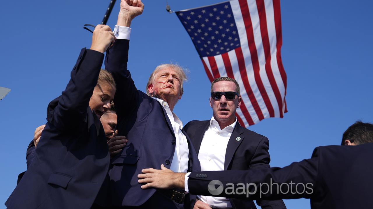 Another photo from the sequence, clearly showing Trump's jacket intact