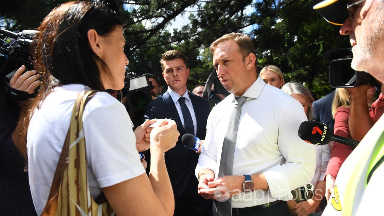 Steven Miles talks to a voter at a victims of crime rally  (file)