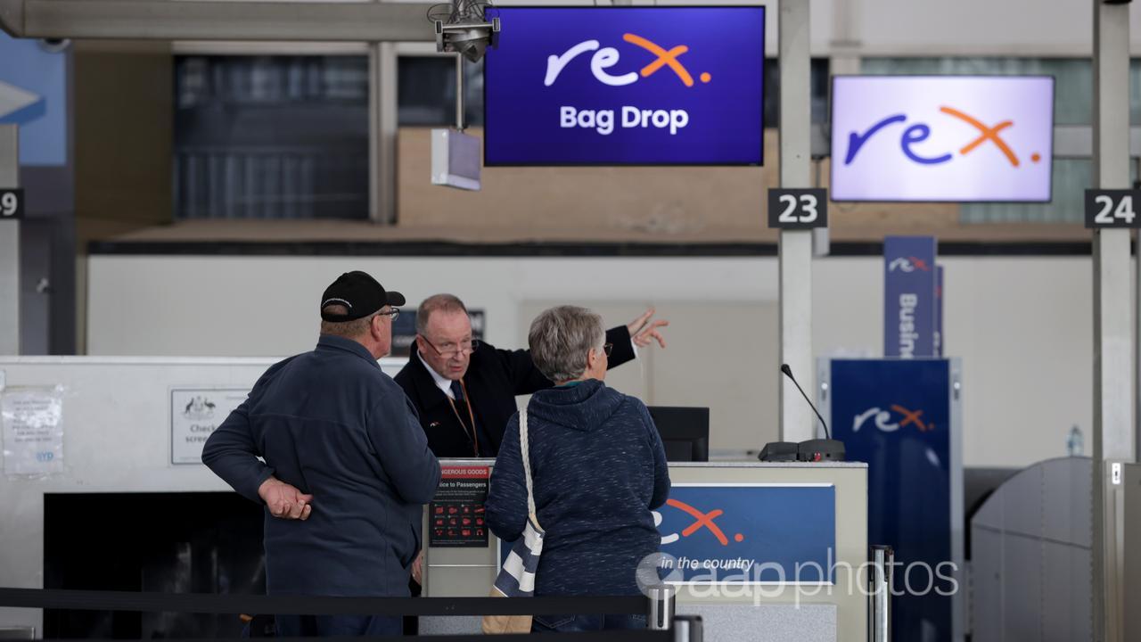 Rex staff and passengers at Sydney Airport