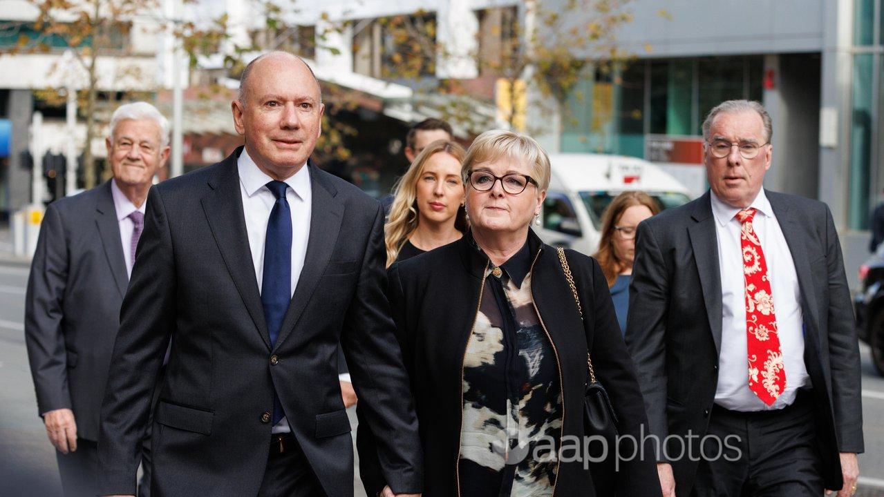 Linda Reynolds with husband Robert Reid and lawyer Martin Bennett