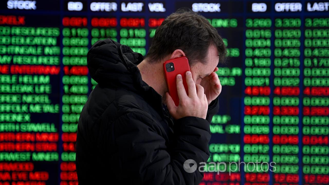 A man in front of the ASX board in Sydney