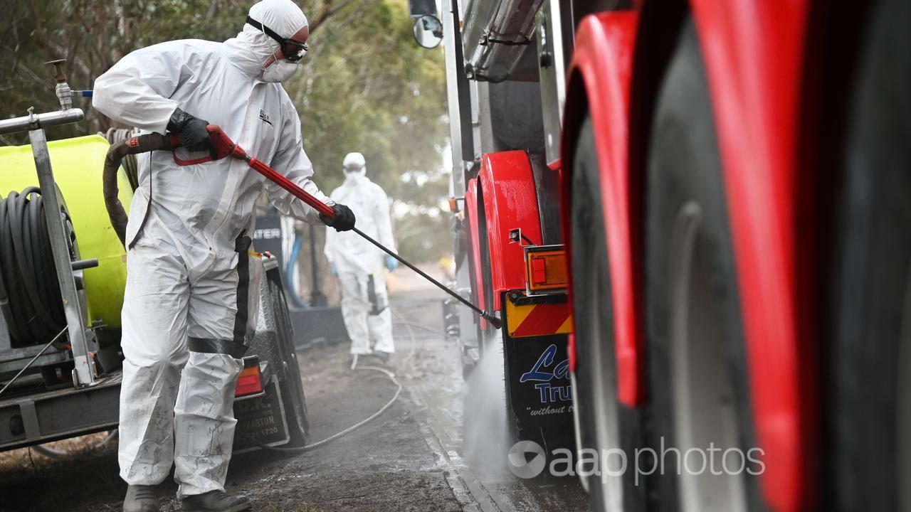 A truck is cleaned in a bird flu quarantine zone.