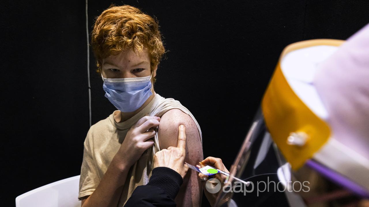 15 year old Jack Guganovic receives a vaccination