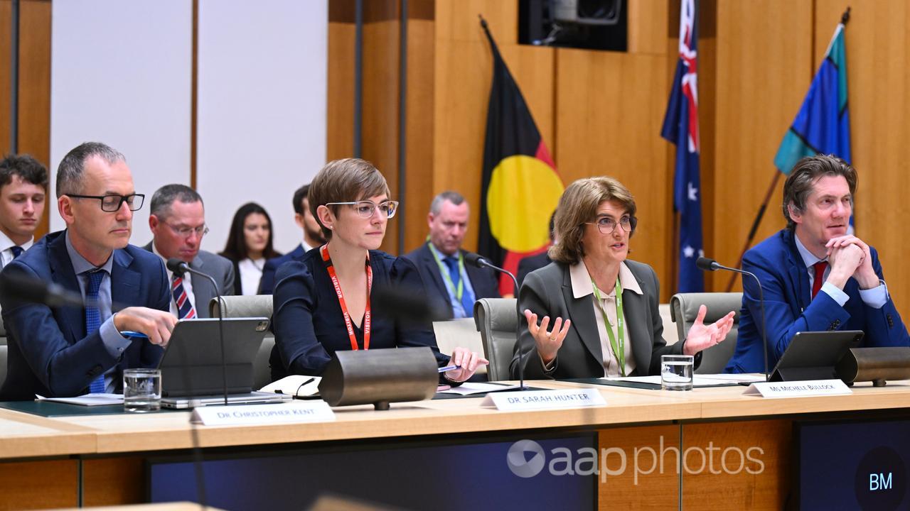 Michele Bullock with other RBA officials