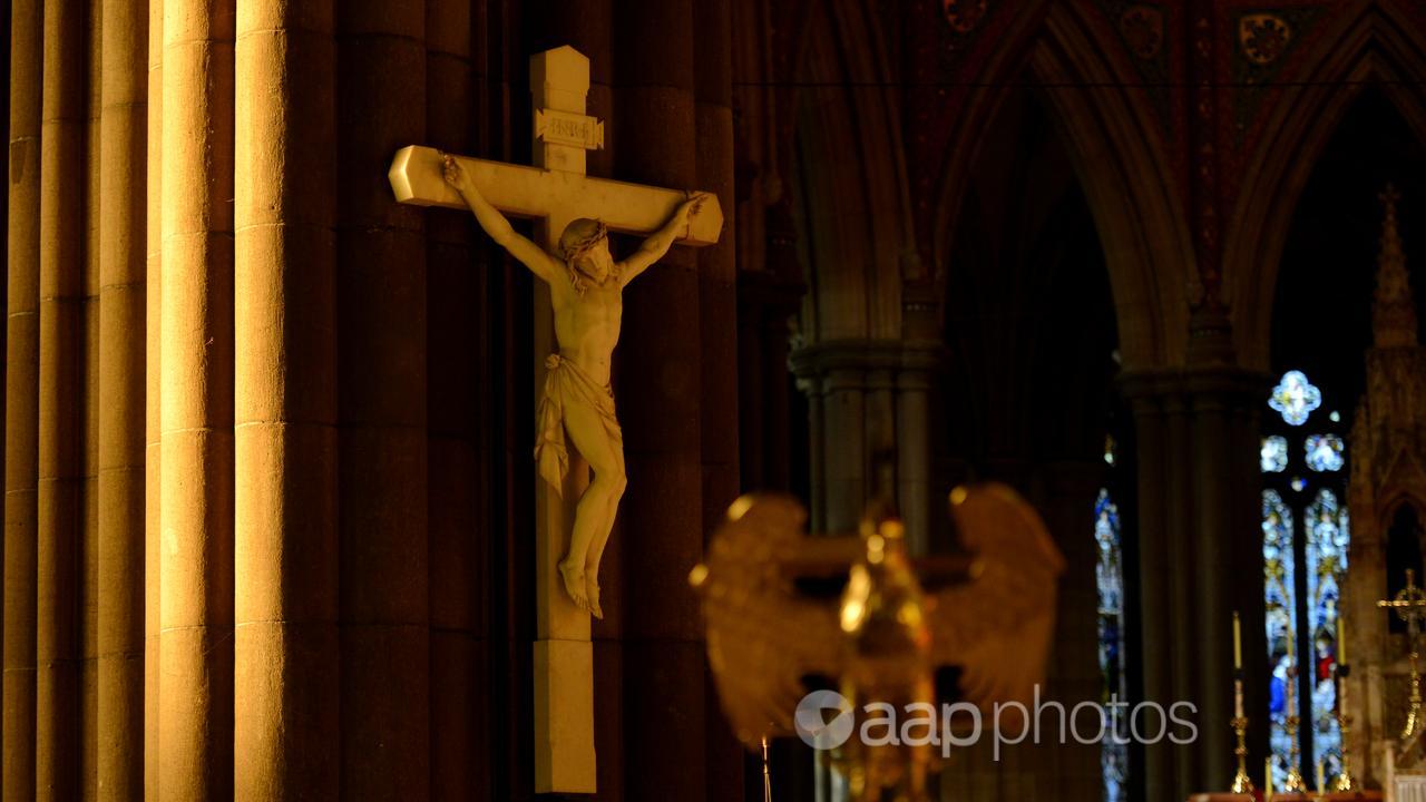 An image of Jesus crucified on a cross in a church.