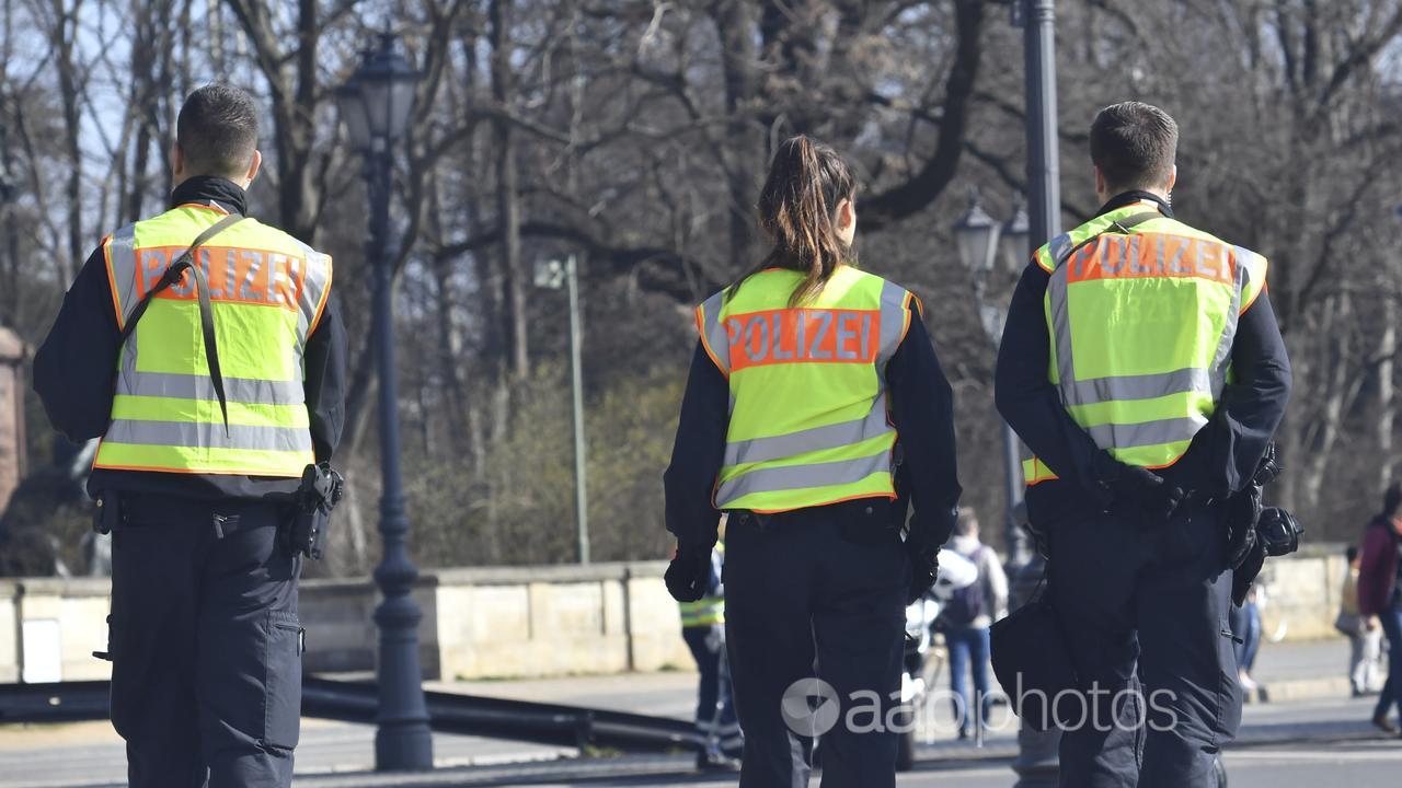 Three German police in Berlin.