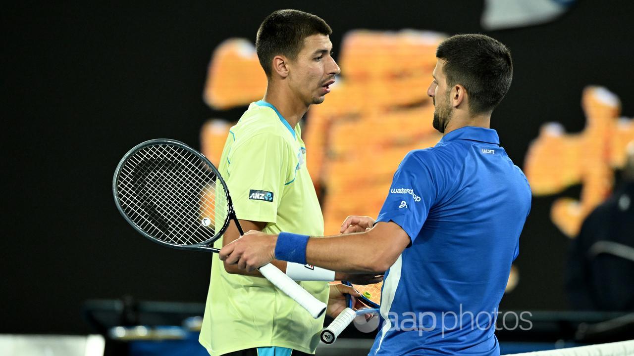 Alexei Popyrin and Novak Djokovic 