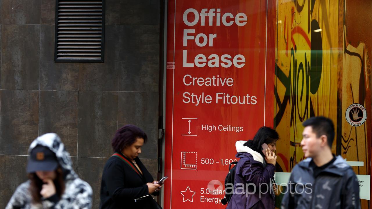 People are seen along Bourke Street in Melbourne,