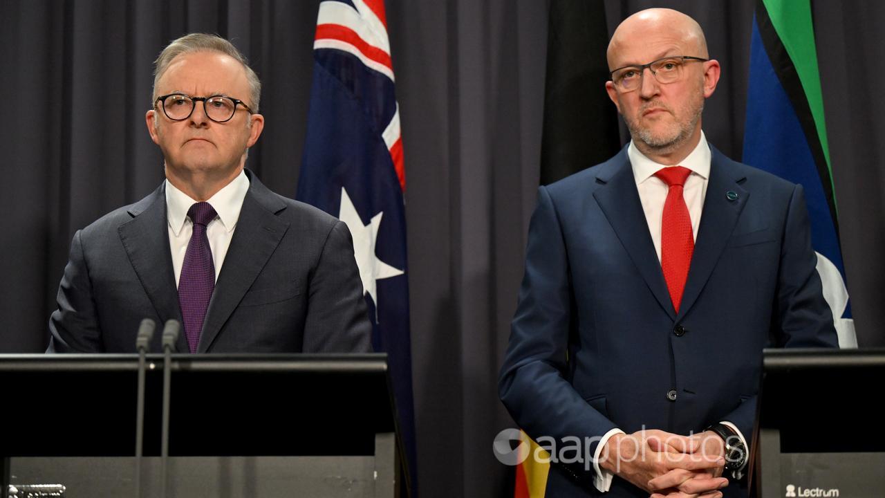 Two men at a press conference.