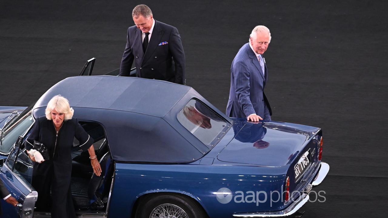 King Charles and Queen Camilla arrive in a car