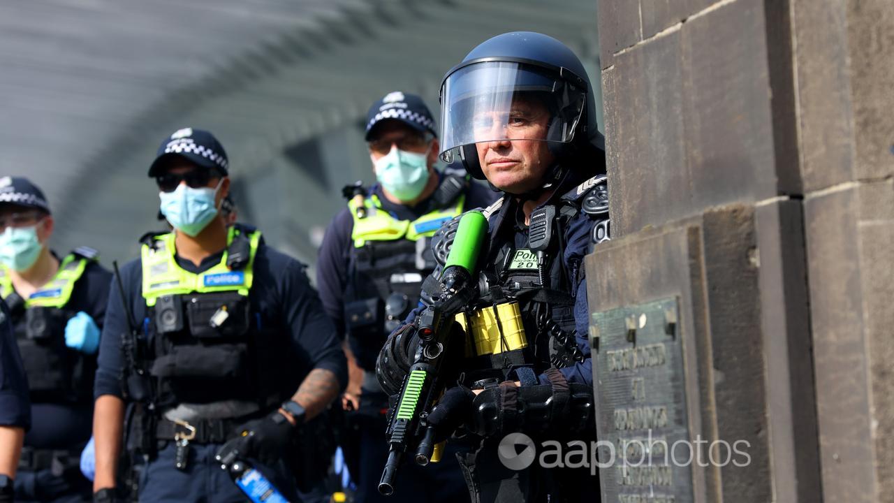 Police at a protest against the LandForces Land Defence Expo