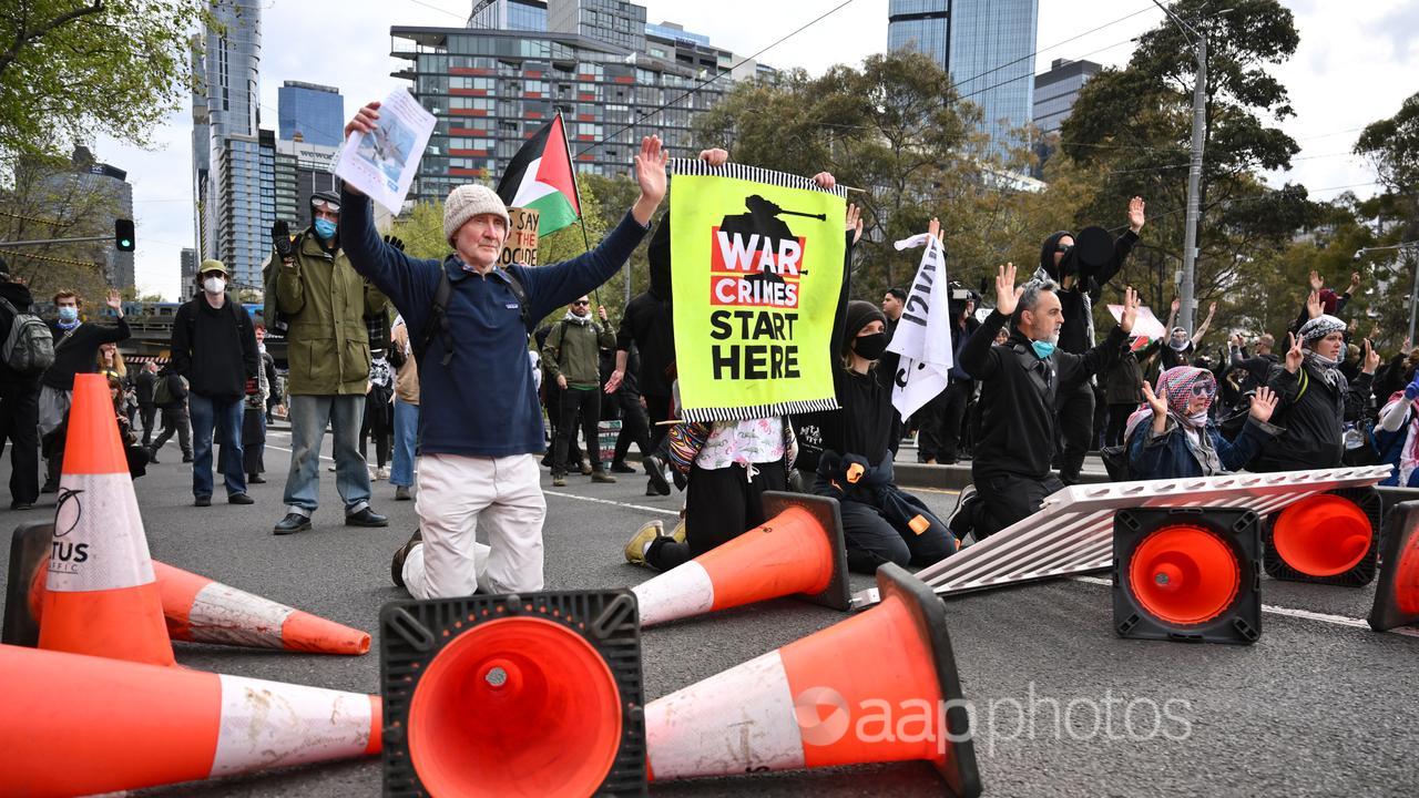 Protesters rally at the LandForces International Land Defence Expo