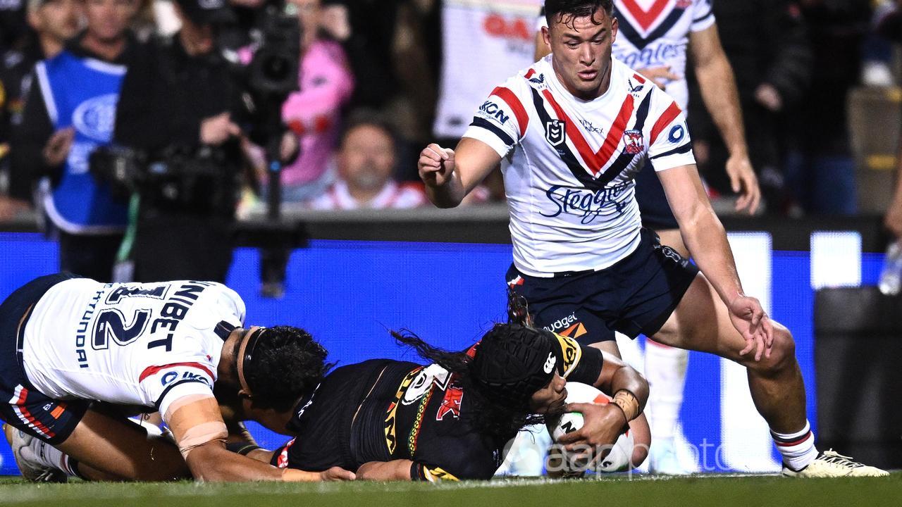 Jarome Luai of the Panthers scores a try.