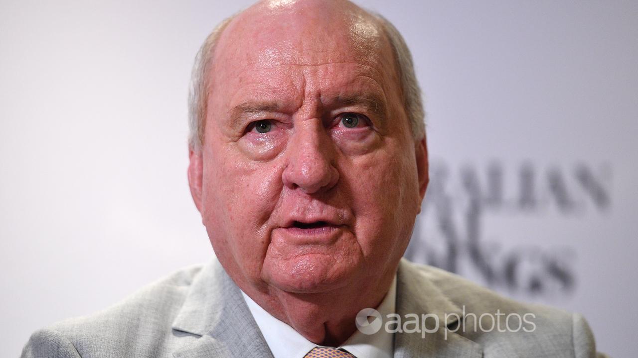 Alan Jones speaks to journalists in Sydney in December 2021.