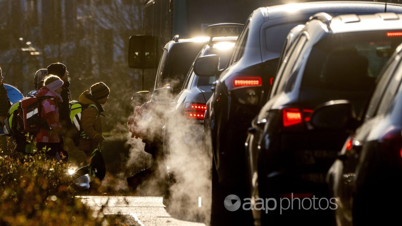 Cars emitting exhaust fumes, Germany.