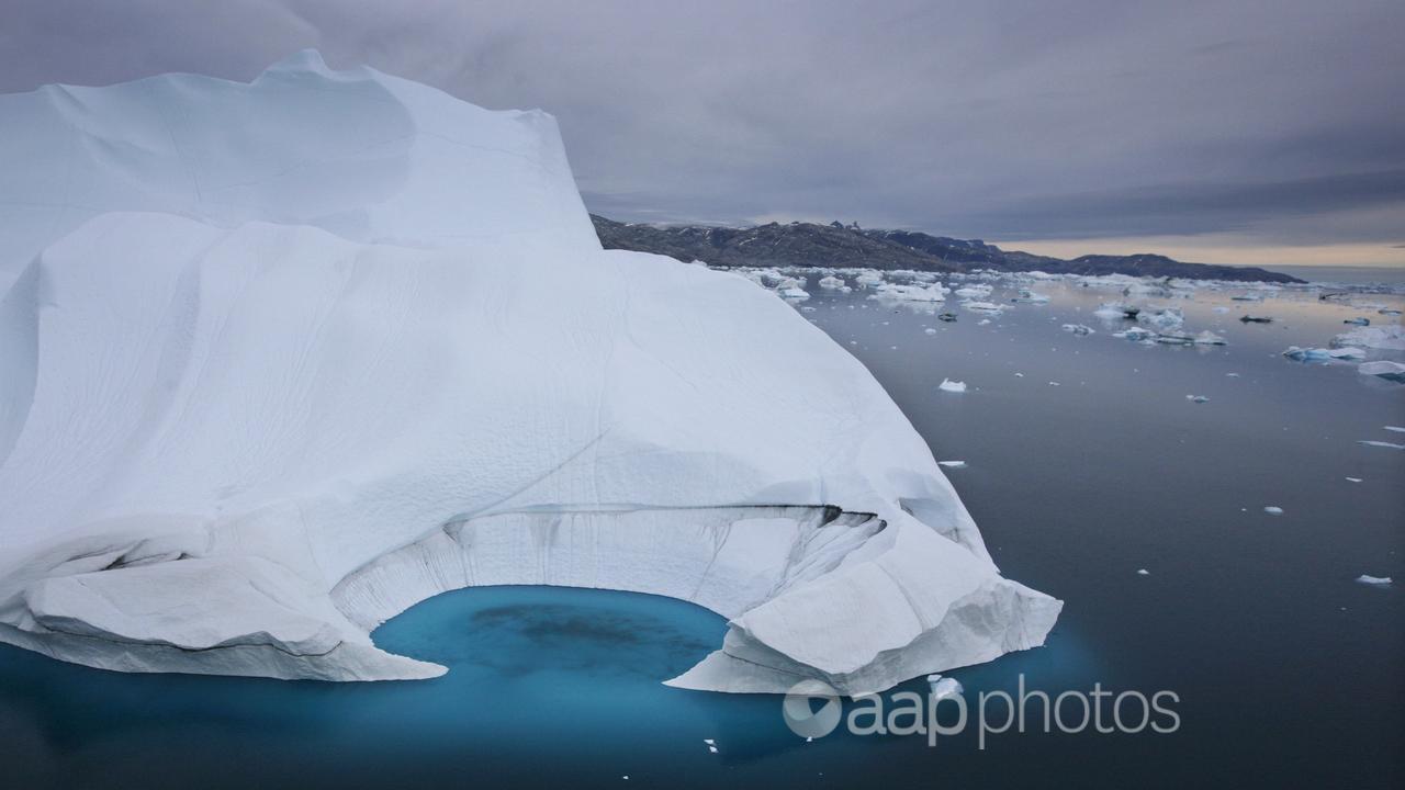 An iceberg is seen melting off the coast of Ammasalik, Greenland.