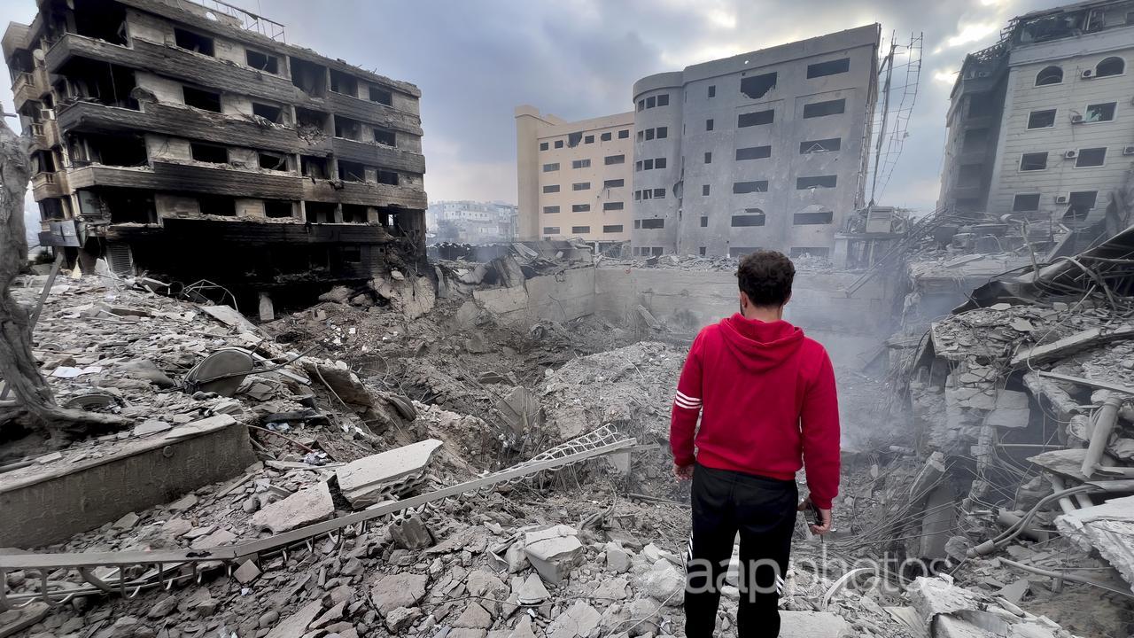 A man looks at destroyed buildings in Beirut, Lebanon.