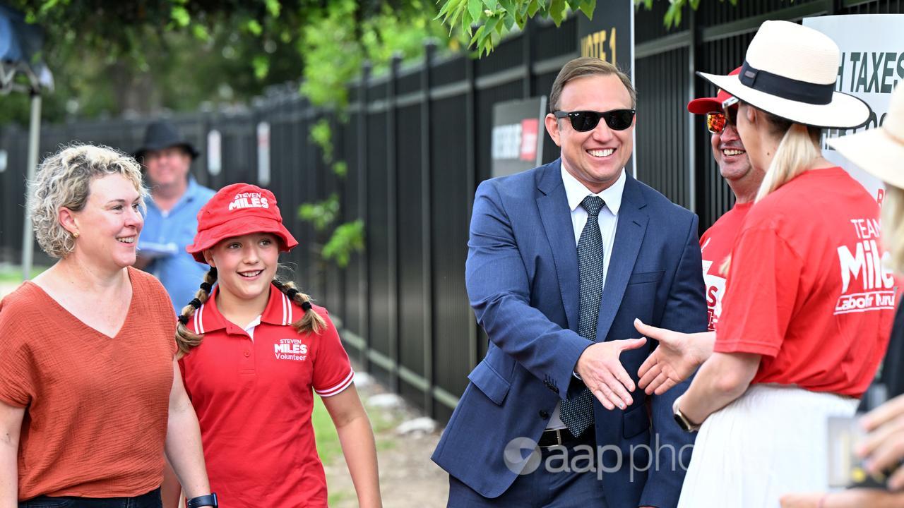 Queensland Premier Steven Miles, his wife Kim and daughter Bridie