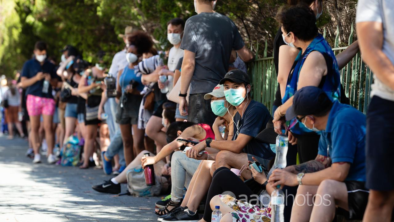 People queue for COVID-19 tests in January 2021