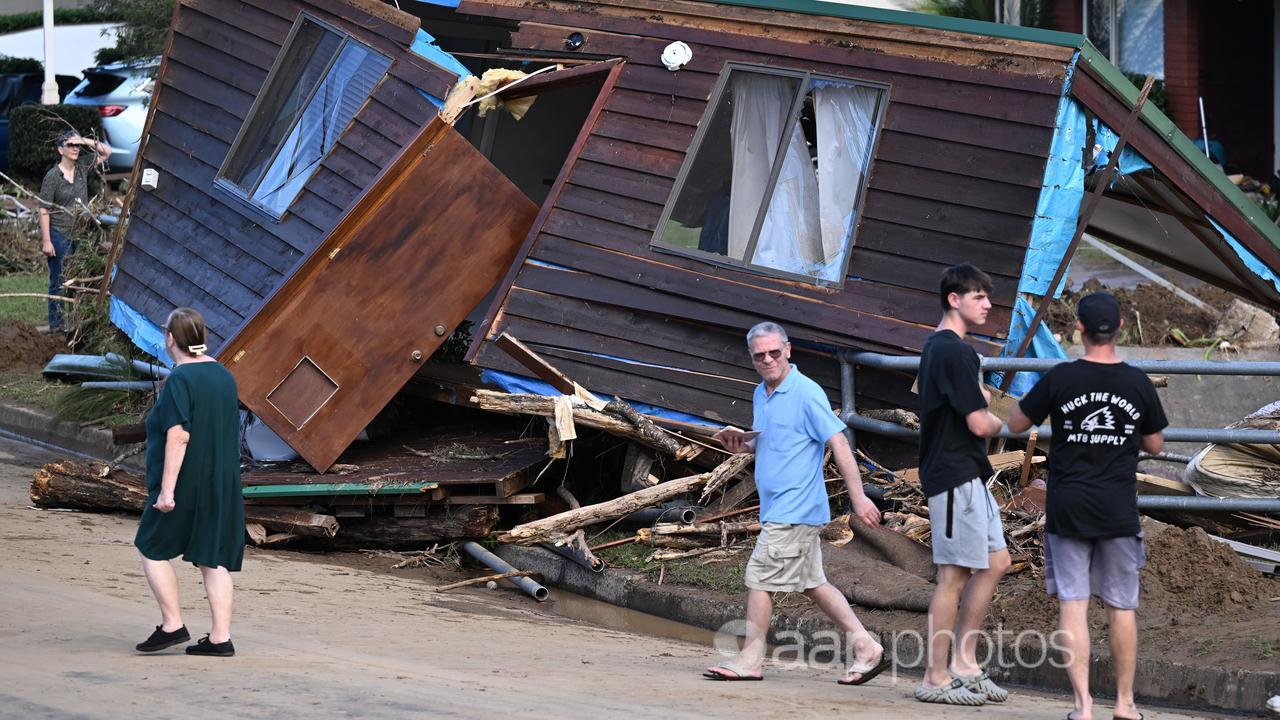 A house is washed away in floods (file image)