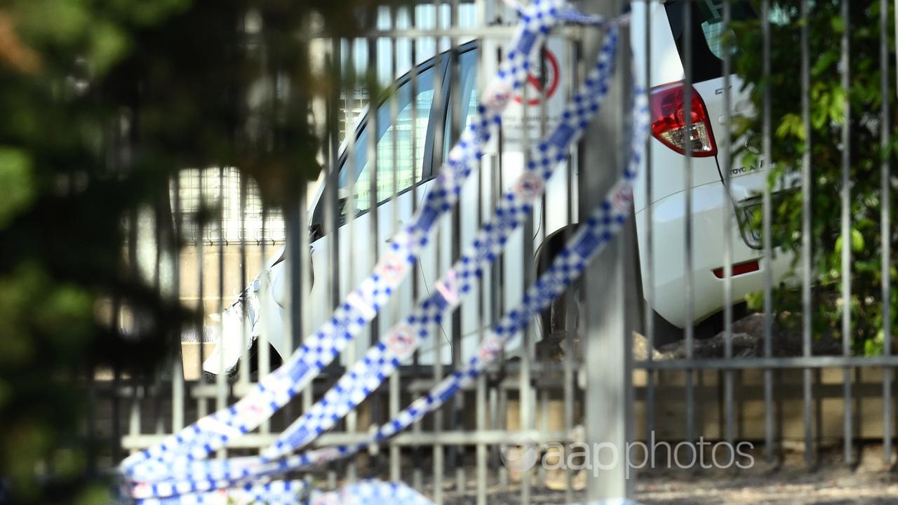 Police tape and crashed car