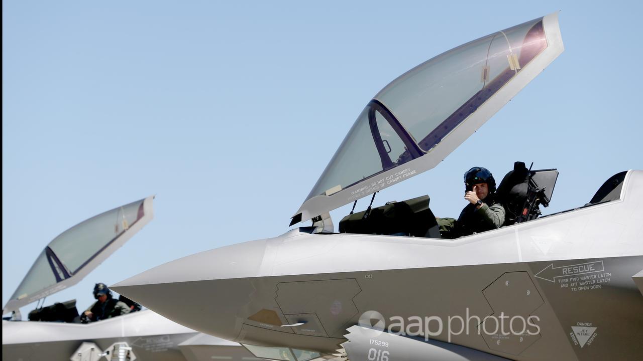 Squadron leader give the thumbs-up from a RAAF f-35A fighter jet