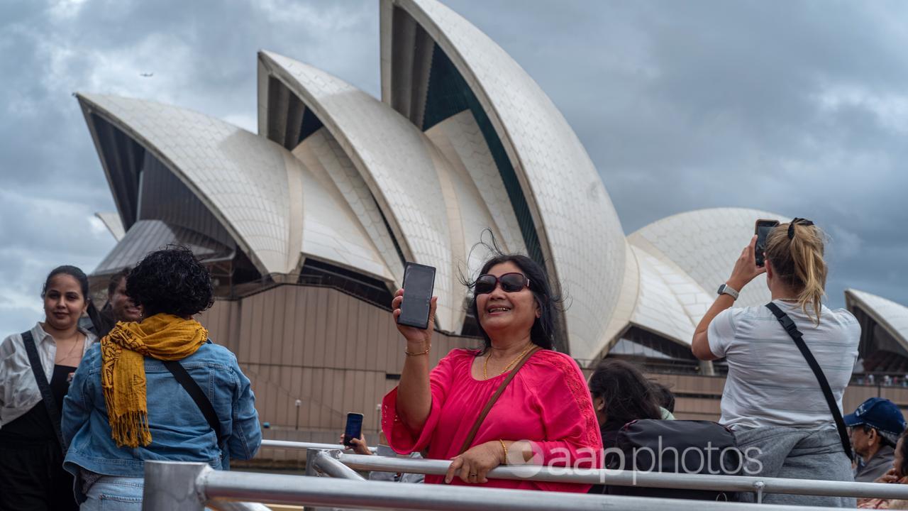 Tourists outside the Sydney Opera House