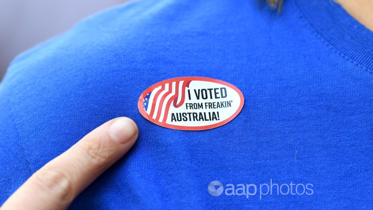 Person wears sticking saying I Voted From Freakin' Australia!