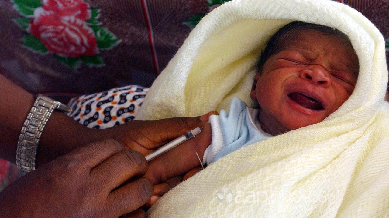 A baby is inoculated in Freetown, Sierra Leone